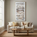 Ethereal hand-painted canvas in a slim gold frame above a cream sofa